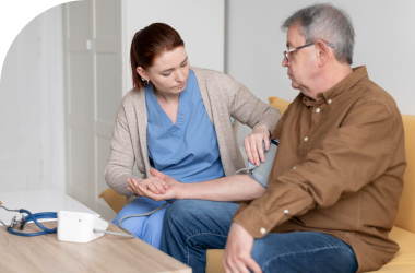 Image-showing-a-caregiver-performing-daily-check-ins-with-an-elderly-man