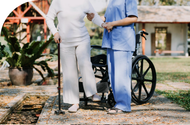 A caregiver is providing mobility assistance