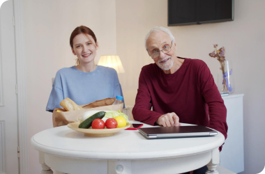 caregiver assists with nutritional guidance and planning to a senior man