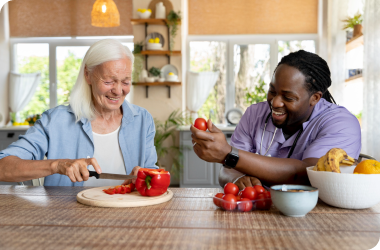 elderly woman engaging in daily living activities with caregiver