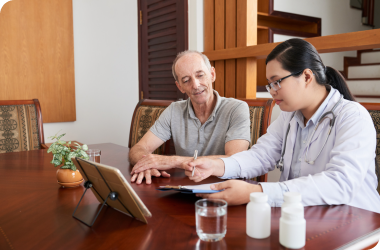 Homecare assistant providing appointment support to elderly person