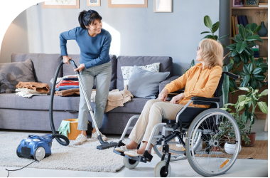 image-of-a-caregiver-tidying-up-a-living-room-doing-light-housekeeping