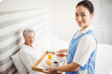 Old man receiving assistance with household chores service