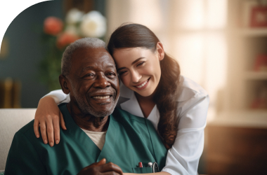 smiling caregiver assisting elderly man with multiple sclerosis care services